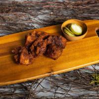 Spicy Bbq Wings · Our famous wings fried until perfectly golden. Tossed in garlic sauce, served with your choi...