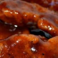 Bbq Tenders · White meat chicken tenders battered and fried until perfectly golden. Served with garlic sau...