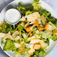 Caesar Salad · Crispy romaine tosses with croutons, Caesar dressing, and grated cheese.