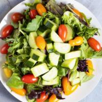 Garden Salad · Cucumbers, tomatoes, red onion, mixed greens.