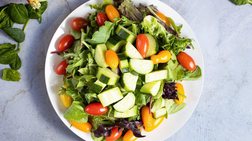 Garden Salad · Cucumbers, tomatoes, red onion, mixed greens.