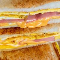 Breakfast Sandwich · Two eggs, choice of bread, bagel, English muffin or croissant, choice of bacon, sausage or c...