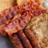 The Lumber Jack · Two eggs, cooked to order, two strips of bacon, sausage, country ham, hash browns and your c...