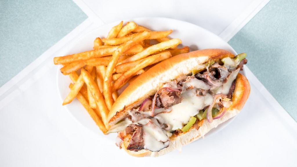 Philly Cheese Steak Sandwich · Grilled sirloin steak topped with Provolone cheese, mayo, sautéed onion, di-green and red bell peppers served in an open-hued hoagie roll.