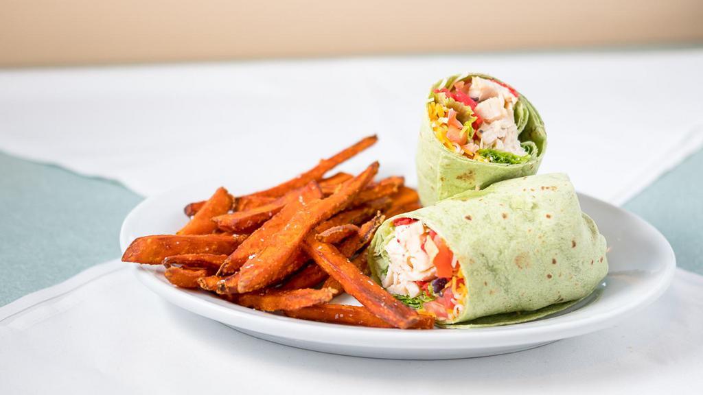 Southwest Chicken Wrap (Hot) Sandwiches · Grilled, chicken breast, lettuce, and tomato, topped with pepper Jack cheese, chipotle ranch, and a mix of tortilla strips in a spinach wrap.