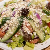Greek Salad · Fresh romaine lettuce, tomatoes, onions, and cucumbers with greek black olives, feta cheese,...