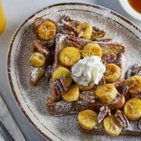 French Toast Supreme · House specialty. With Fried bananas, pecans and whipped cream.