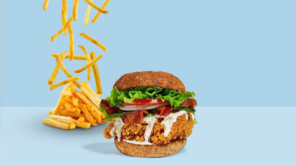 Join The Club Fried Chicken Sandwich · Crispy fried chicken, bacon, cheddar cheese, lettuce, tomato, and fry hard sauce served on a toasted bun.