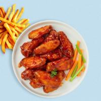 Wild Buffalo Wings · Fresh chicken wings breaded, fried until golden brown, and tossed in buffalo sauce. Served w...