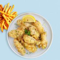 Parm Party Wings · Fresh chicken wings breaded, fried until golden brown, and tossed in garlic and parmesan. Se...