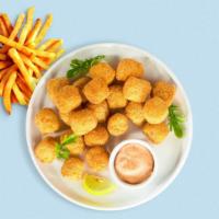 See You Tater · Shredded Idaho potatoes formed into tots, battered, and fried until golden brown.