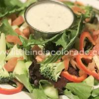 Little India Salad · Diced cucumbers, lettuce, tomato, and carrots with homemade yogurt dressing