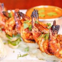 Shrimp Tandoori · Finest jumbo shrimp on onion-bed in sizzler.