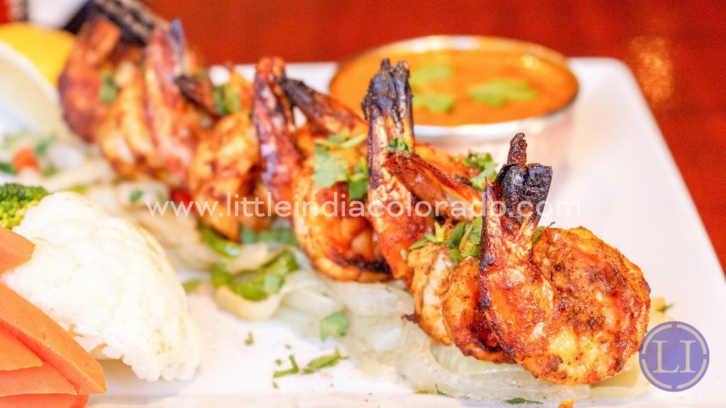 Shrimp Tandoori · Finest jumbo shrimp on onion-bed in sizzler.