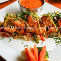 Chicken Ginger Kabob · Boneless chicken breast cubes marinated in ginger mint sauce on onion-bed in sizzler.
