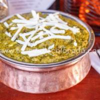 Saag Paneer · Spinach cooked with homemade cheese, in cream.