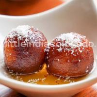 Gulab Jamun · A classical Indian dessert made of milk balls in sweet warm syrup.