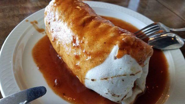 Adovada Burrito · Vegetarian. Jackfruit adovada, pinto beans, potato, and cheese wrapped in a flour tortilla. Smothered in red chile sauce and drizzled with lime crema. Served with corn tortilla chips and Acre salsa.