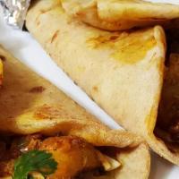 Chicken Curry Wrap · Marinated chicken curry with spices topped with grilled onions and peppers wrapped in naan. ...
