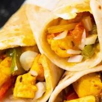 Panner Wrap · Marinated paneer with spices, topped with grilled onion and peppers wrapped in naan. Served ...