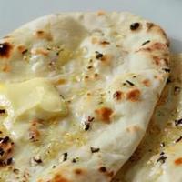 Butter Naan · Indian flat bread prepared in oven, topped with butter. 2 pieces