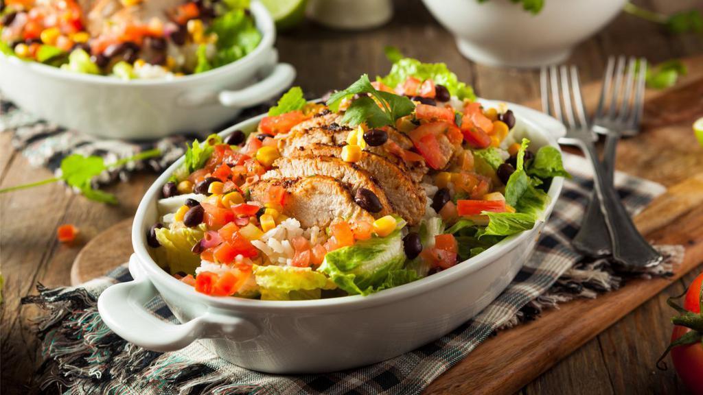 Chicken Fajita Taco Salad · Juicy chicken fajita mix on a crispy flour tortilla bowl filled with lettuce, tomato, cheese with whole, black or refried beans topped with salsa and sour cream.