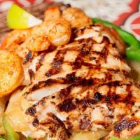 Chicken & Shrimp Fajitas · Delicious marinated shrimp and juicy chicken sautéed with bell peppers and onions, served on...