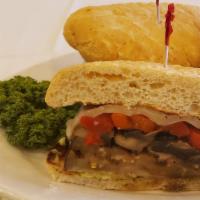 Our Roman Garden Sandwich · Grilled eggplant and portabella mushrooms with roasted red peppers, provolone cheese, lettuc...