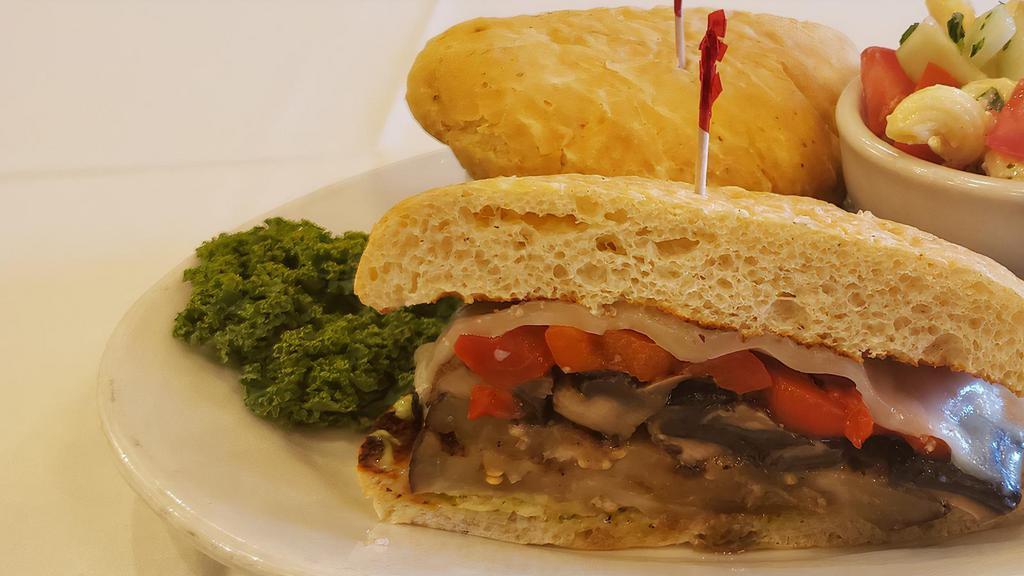 Our Roman Garden Sandwich · Grilled eggplant and portabella mushrooms with roasted red peppers, provolone cheese, lettuce and tomato served on toasted french bread with choice of marinara or pesto aioli dressing.