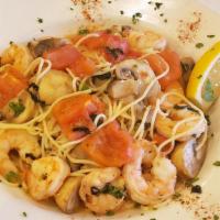 Shrimp Scampi · Shrimp and mushrooms sauteed in roasted garlic and tossed with a white wine sauce basil and ...