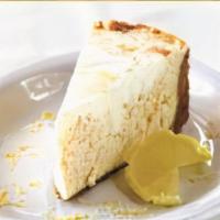 New York Style Cheese Cake · Our house recipe New York style cheesecake with a hint of lemon. Served on a traditional gra...