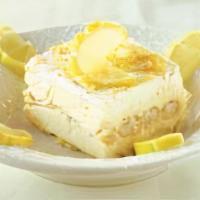 Lemon Tiramisu · Lady fingers basted in Limoncello with whipped mascarpone filling and garnished with lemon z...