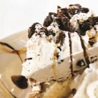Mud Pie · Cappuccino Ice Cream, Vanilla Ice Cream separated by a layer of roasted walnuts and caramel....