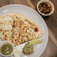 Birria Quesadilla · Flour tortilla filled with melted cheese and birria. Served with  salsa, consome, sour cream...