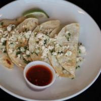 Birria Tacos · Corn tortilla filled with birria topped with queso fresco, cilantro and onion. Salsa on the ...