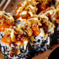 Dynamite Roll · Inside out rolled filled with crispy, golden battered shrimp tempura, creamy avocado and cuc...