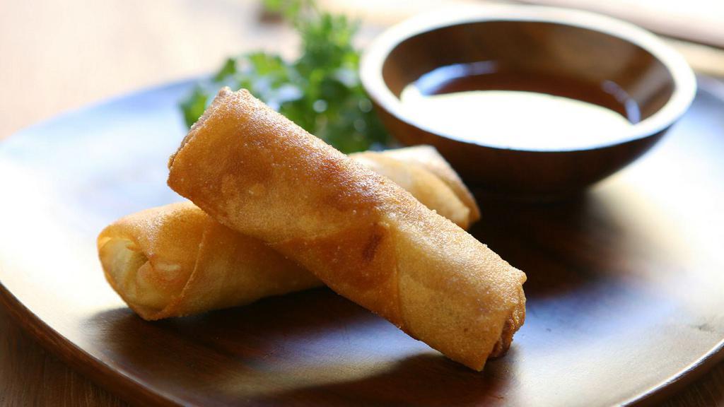 Vegetable Spring Rolls (5) · Rice paper stuffed with finely chopped veggies including carrots and cabbage with garlic and ginger. Fried until crisp and browned on the outside.