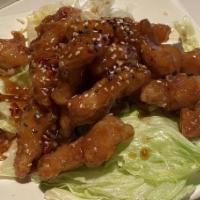 Sesame Chicken · Spicy. Lightly battered slice of chicken breast sauteed in spicy sesame sauce