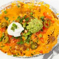 Super Nachos · Corn tortilla chips topped with your choice of Ground Beef, Chicken or Picallo; refried bean...