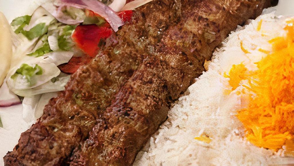 Chicken Kabob Rice Bowl · Our Famous Chicken Kabobs served on bed of rice! Includes Chopped Salad, Sumac Onions, and Pickles, Served with sauce and Pita Bread
