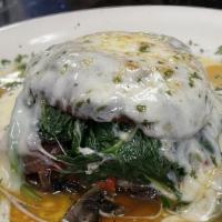 Roasted Portabello · A roasted portabello mushroom stuffed with sauteed spinach, roasted peppers, and caramelized...