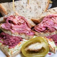 Clary Silver · pastrami, corned beef, Swiss cheese, cole slaw and Russian dressing.