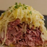 The Reuben · Corned beef, sauerkraut, Swiss cheese and Russian dressing (turkey or pastrami available).