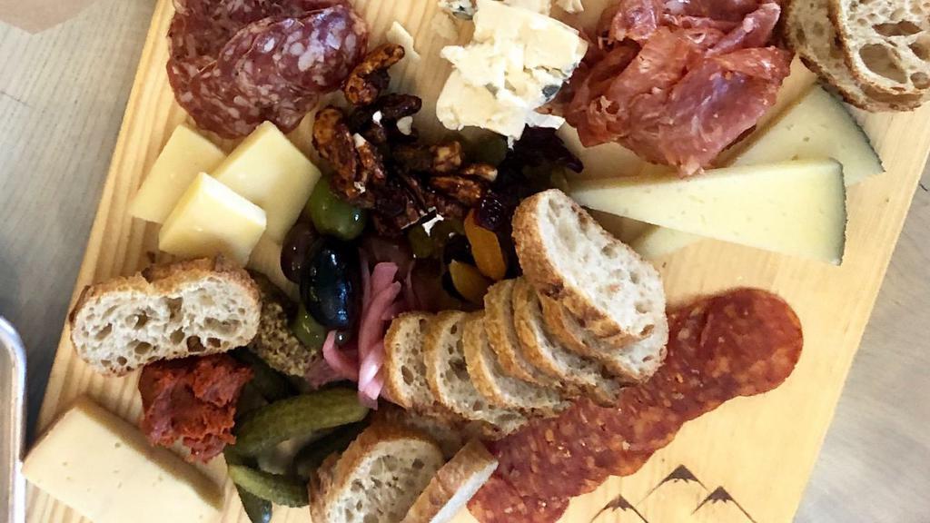 Large Board · Four meat and four cheese selections served with accouterment.