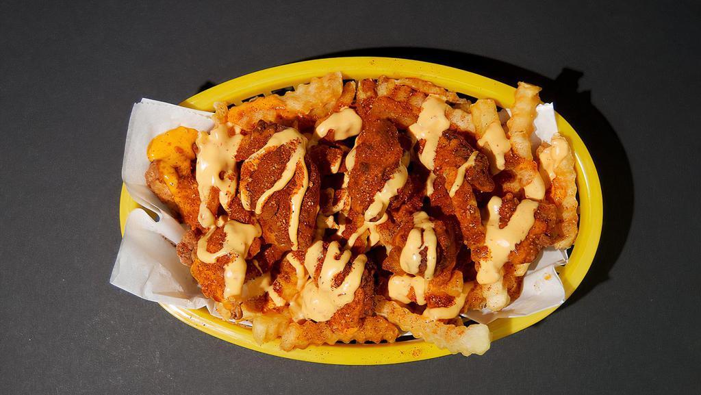 Nashville Hot Chicken Fries · 2 diced Nashville hot chicken tenders, fries, with farm sauce drizzled on top
