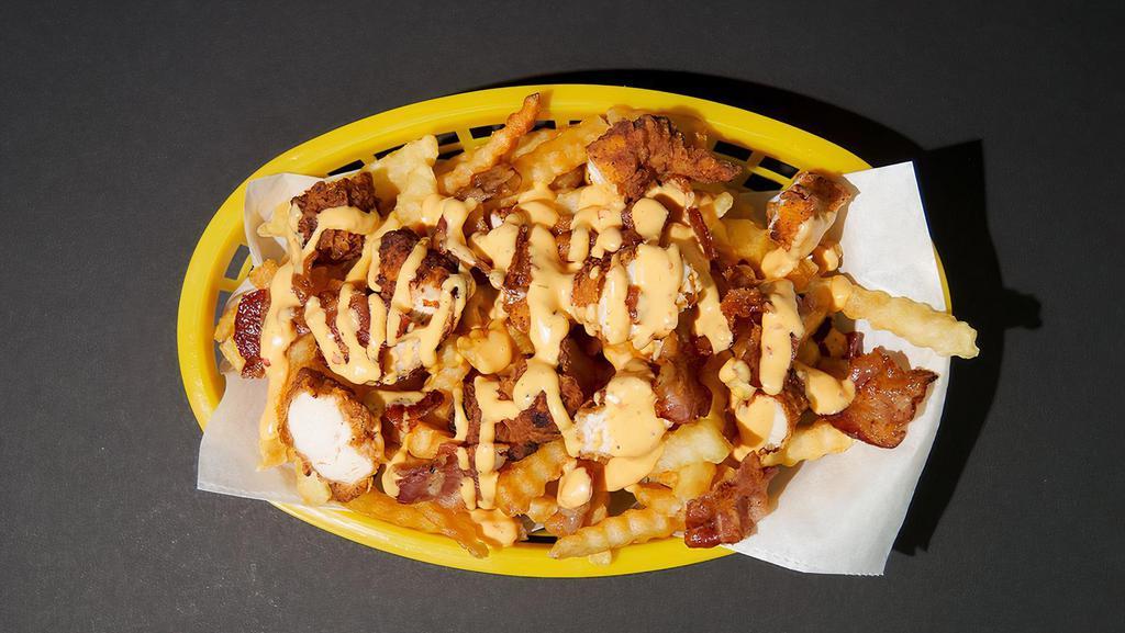 Bacon Chicken Cheese Fries · 2 diced chicken tenders, bacon, fries, with creamy cheese sauce drizzled on top