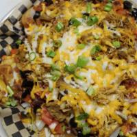 19Th Hole Irish Nachos · Ground beef, shredded chicken or pulled pork over house chips double smothered in shredded c...