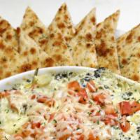 Spinach Artichoke Dip · Creamy artichoke and spinach dip made in-house. Baked with tomato and Parmesan cheese and se...