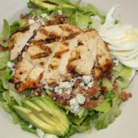 Cobb Salad · Grilled chicken, bleu cheese crumbles, red onion, avocado, egg, bacon and tomato. Served wit...