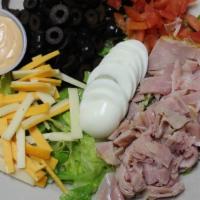 Chef Salad · Fresh romaine served with ham and turkey, topped with tomatoes, olives, hard-boiled egg, che...